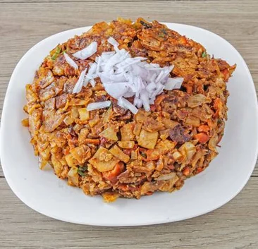 Kothu roti topped with chopped onion, Sri Lankan takeout in Mississauga, ON