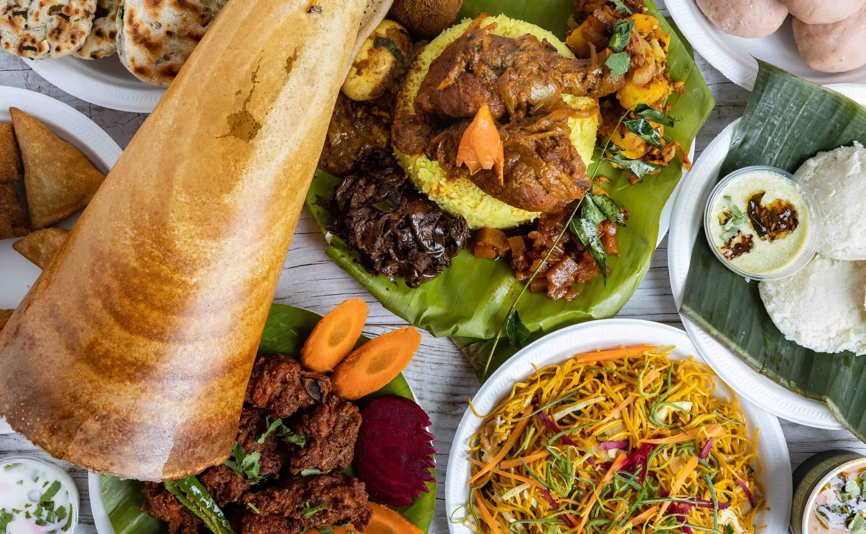 Spread of Sri Lankan dishes on banana leaf